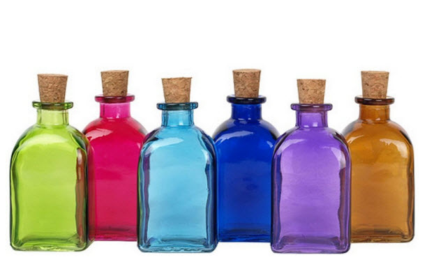 colored glass bottles with corks